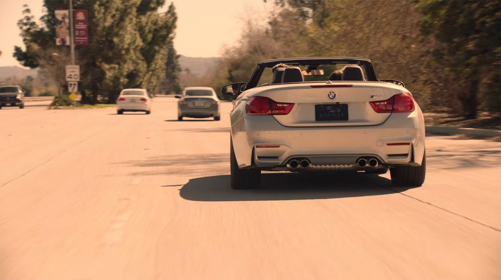 BMW on the road with other cars