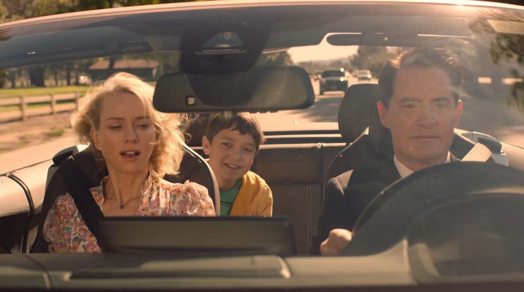 Cooper driving a car with Janey-E and Sonny Jim