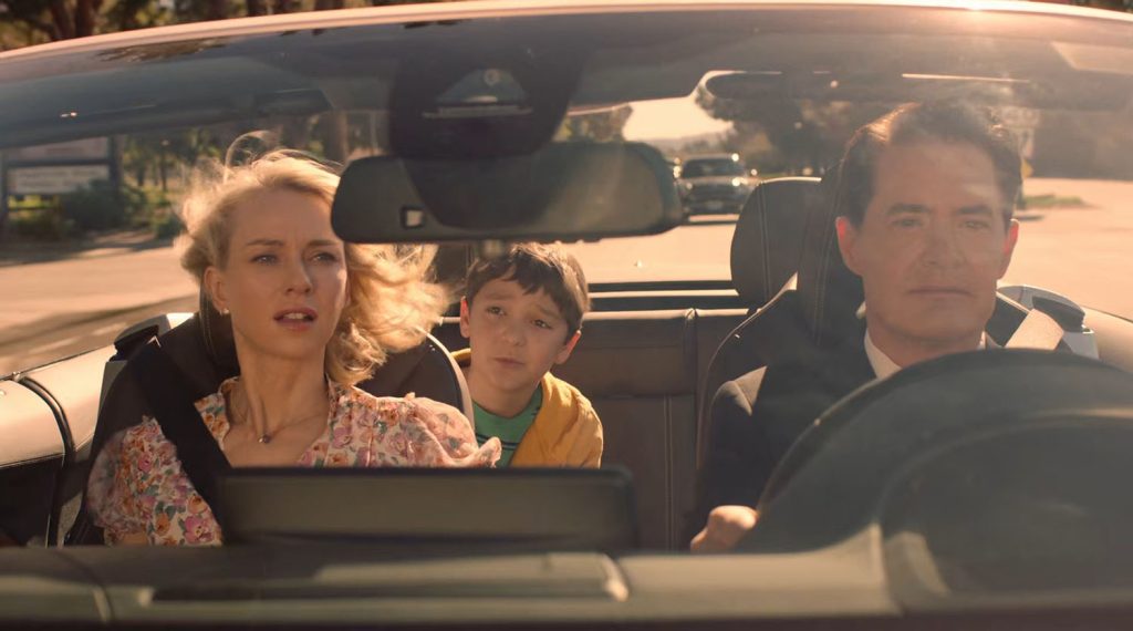 Cooper driving a car with Janey-E and Sonny Jim