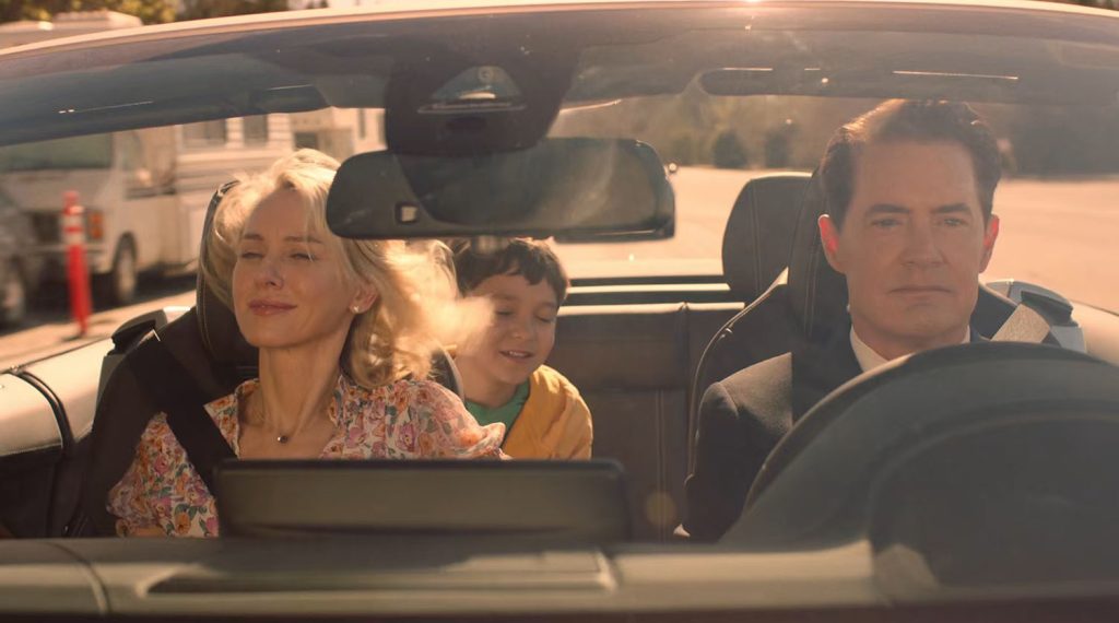 Cooper driving a car with Janey-E and Sonny Jim