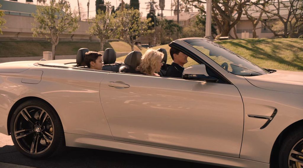 Cooper and family in a BMW