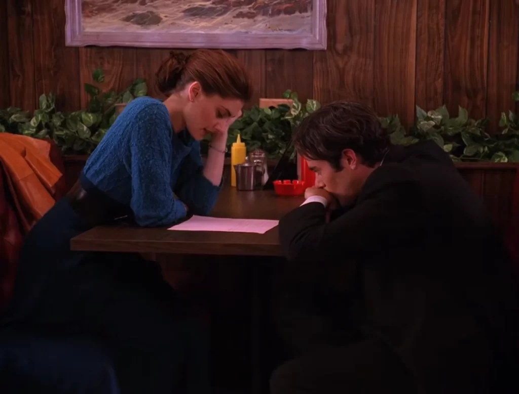 Shelly Johnson and Bobby Briggs at a booth