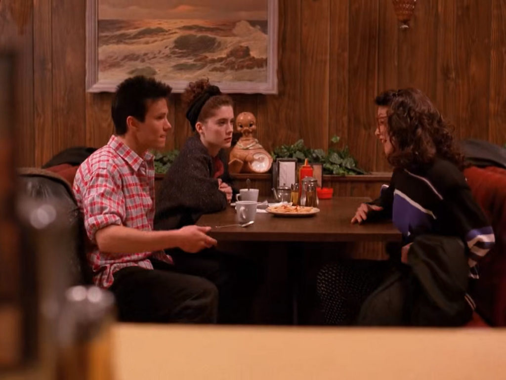 James Hurley, Donna Hayward and Maddy Ferguson at a booth