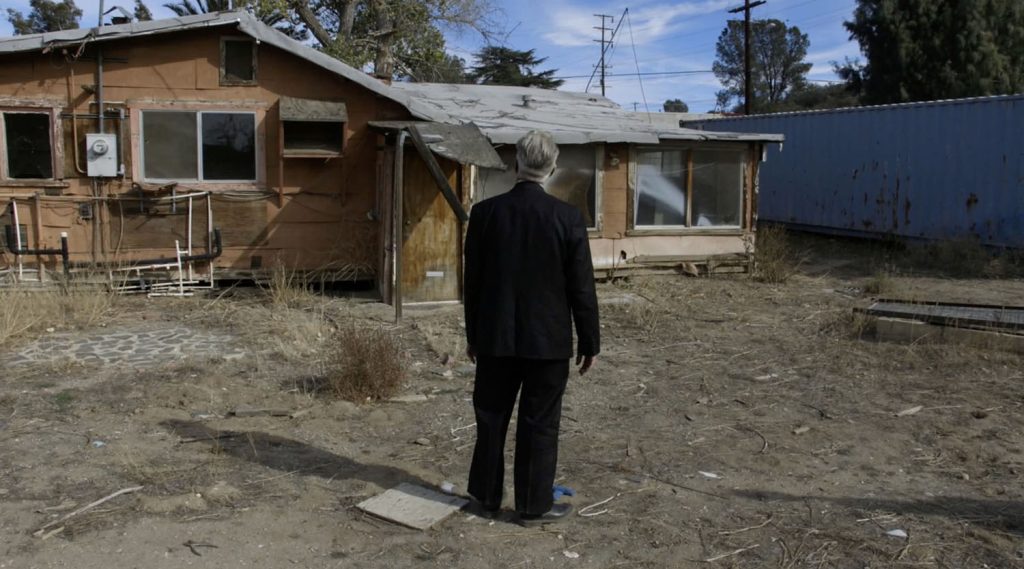 Behind the scenes shot of David Lynch standing on his mark in The Zone