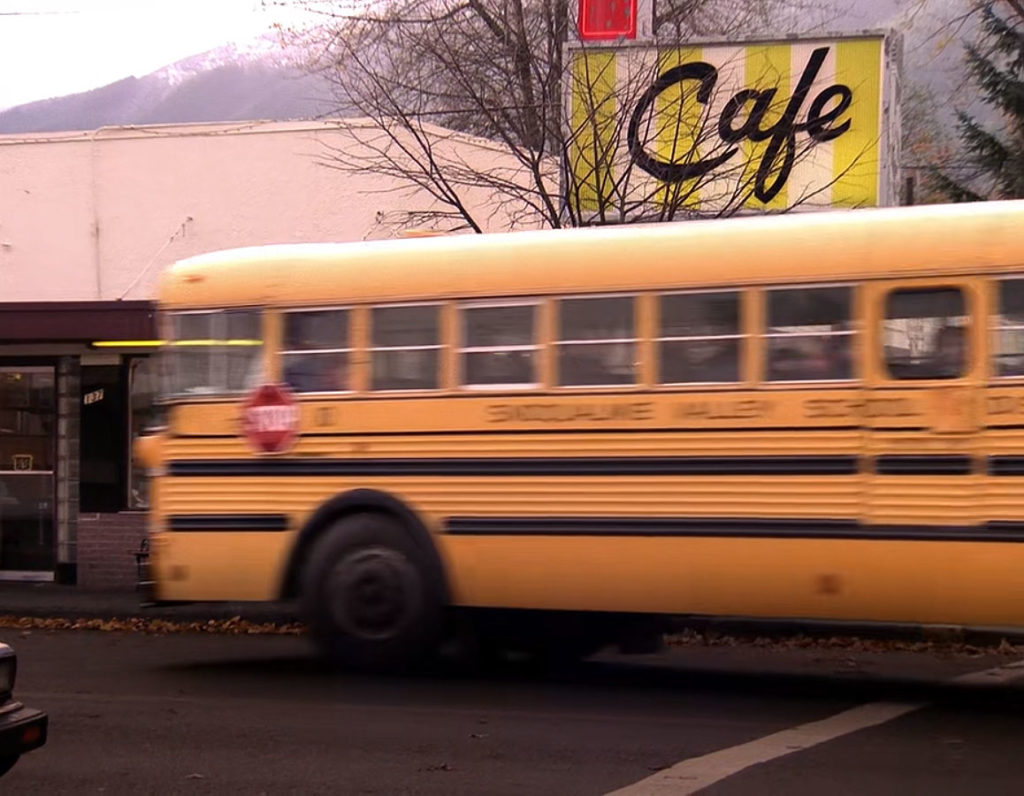 Yellow School bus passing by Double R Diner