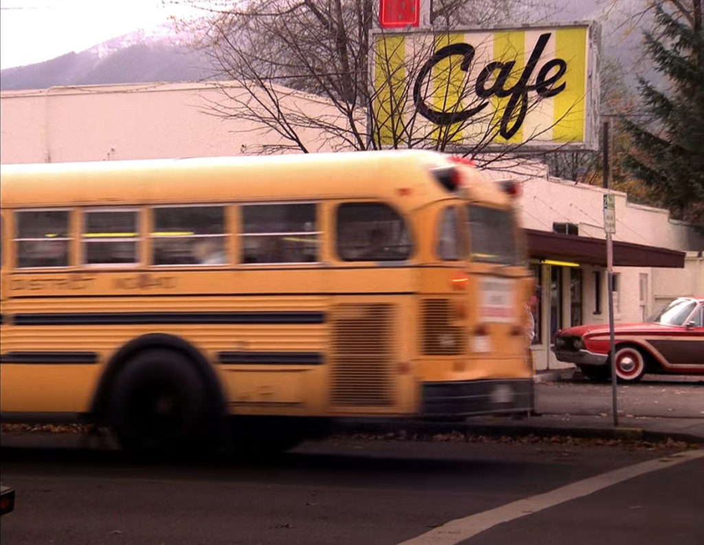 Yellow School bus passing by Double R Diner