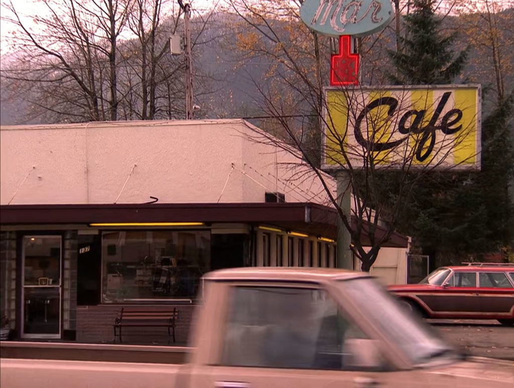 Exterior of Double R Diner with tan truck passing by