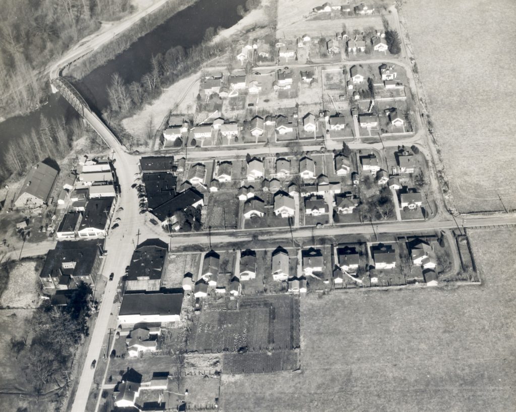 Black and white aerial view of Meadowbrook, Washington with houses and streets