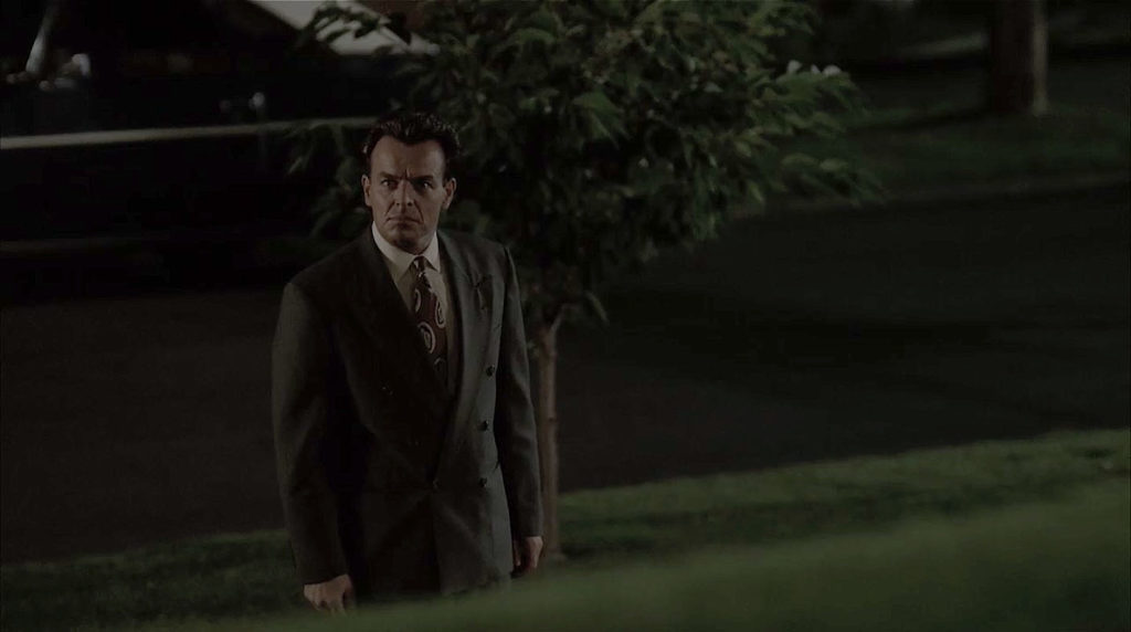 Leland Palmer walking up to his house at Night