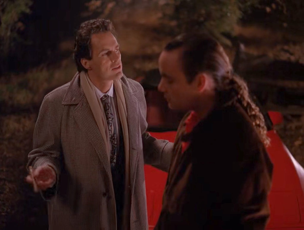 Ben Horne speaking with Leo Johnson in the woods