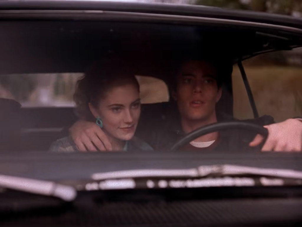 Bobby Briggs drives Shelly Johnson home with his arm resting on her shoulder