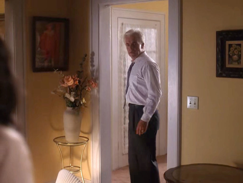 Leland Palmer standing in the doorway looking at Maddy