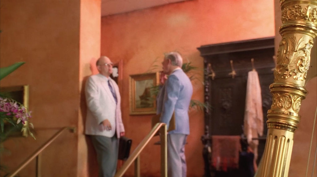 Two gentlemen talking in the lobby of the Palm Deluxe Hotel in Twin Peaks - Fire Walk With Me