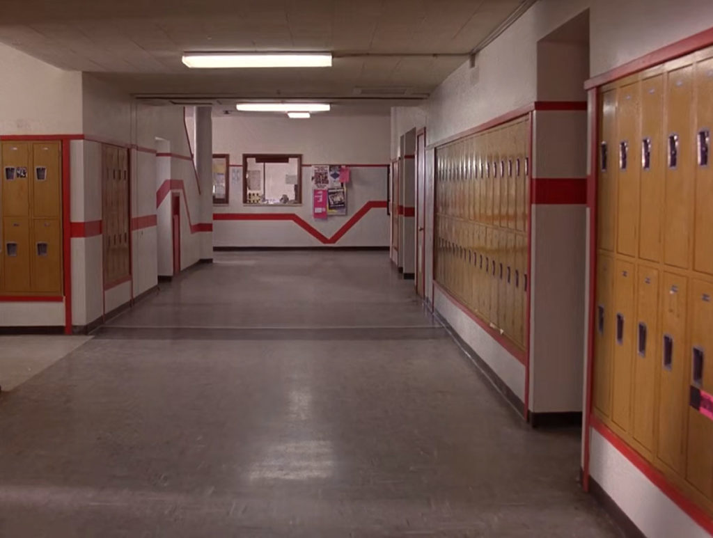 Hallway in Twin Peaks High School with yellow lockers and red striped walls