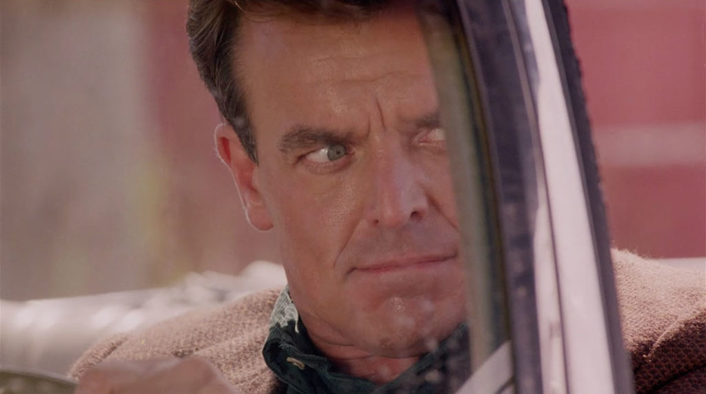Ray Wise as Leland Palmer looking to his left through a car winshield