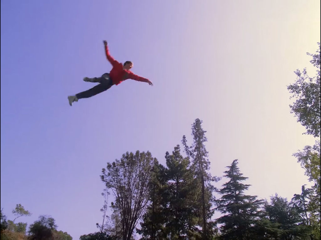 Male Twin Peaks Cheerleader flying through the sky - Corkscrew!