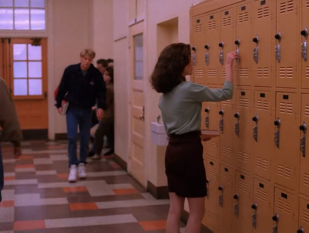Donna Hayward her locker with Mike Nelson walking down the hall in Episode 2012
