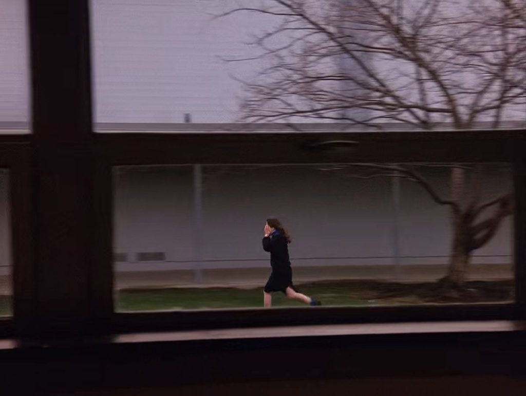 Screaming Girl running through courtyard