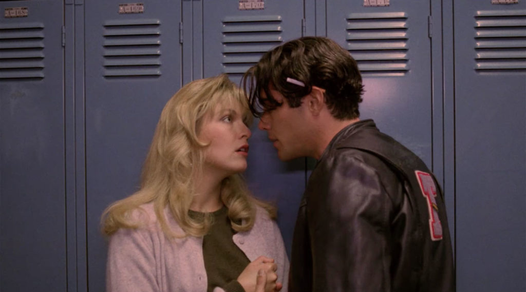 Bobby and Laura against blue lockers