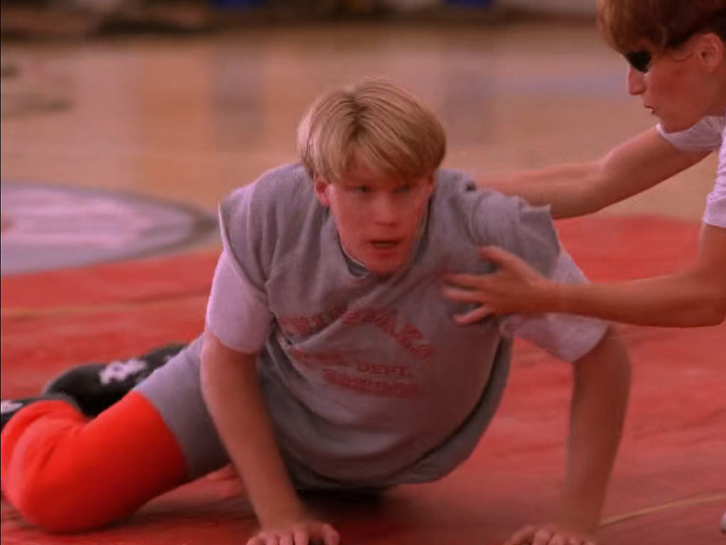 Mike Nelson laying down on the gym mat