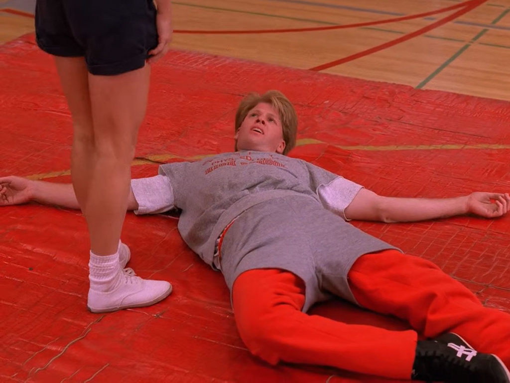 Mike Nelson laying down on the gym mat