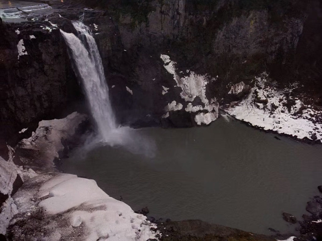 Snoqualmie Falls and snow covered rocks