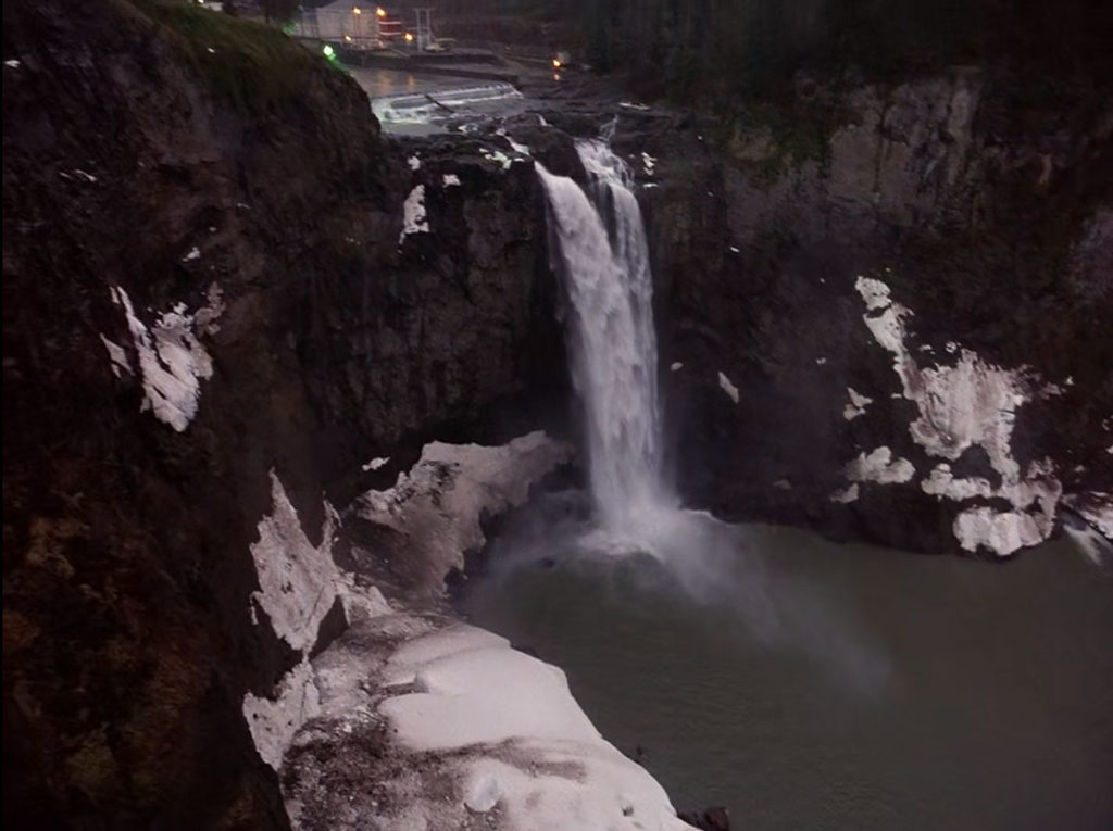 White Tail Falls covered in snow as an establishing shot of The Great Northern Hotel
