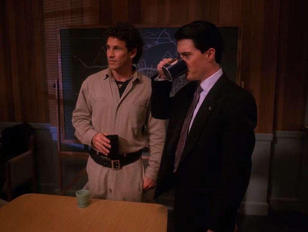 Special Agent Dale Cooper drinking coffee with Sheriff Harry S. Truman