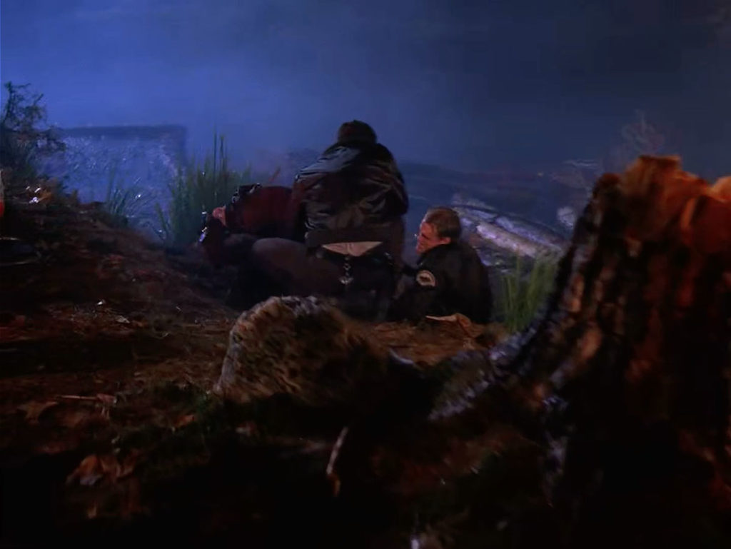 Two sheriff's deputies at the base of the waterfall