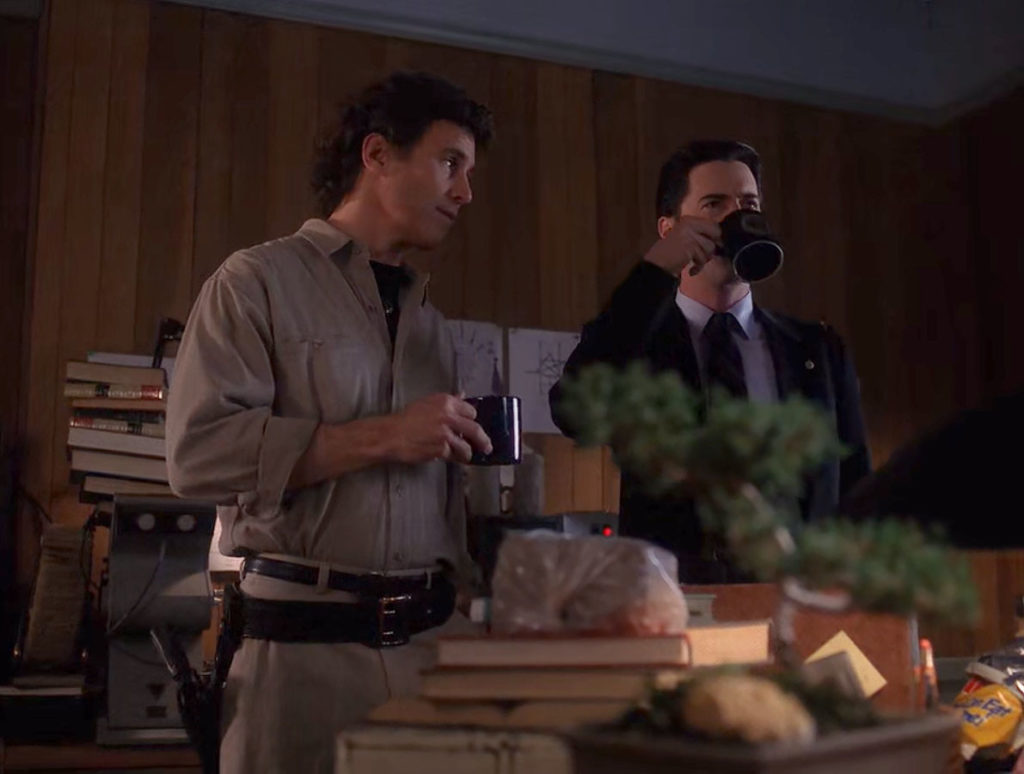 Special Agent Dale Cooper drinking coffee at the Twin Peaks Sheriff's Department with Sheriff Harry S. Truman