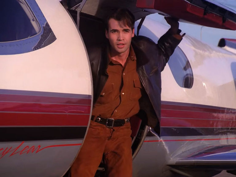 John Justice Wheeler standing on the steps of his jet