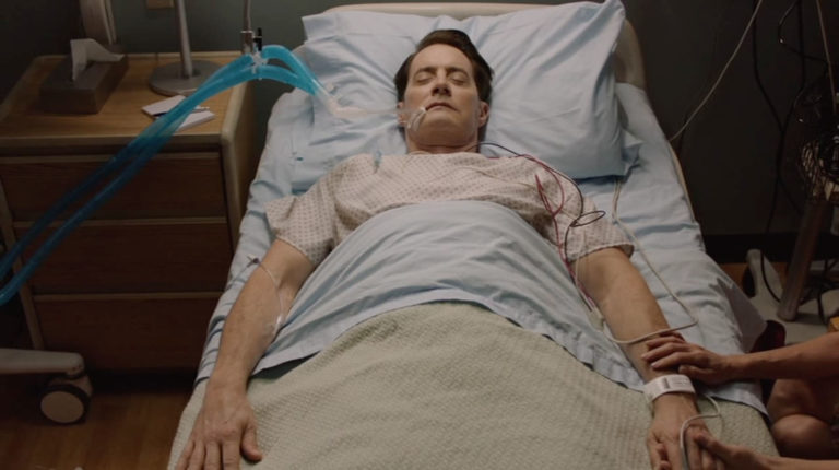 Agent Dale Cooper laying in a hospital Bed