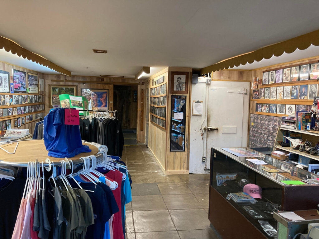 Interior of the Rock Store with merchandise displays and photos on the wall
