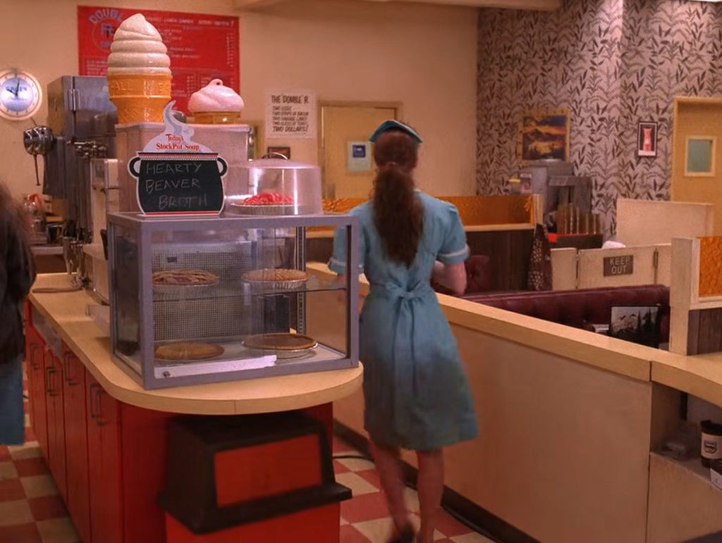 Shelly Johnson walking behind the counter at the Double R Diner