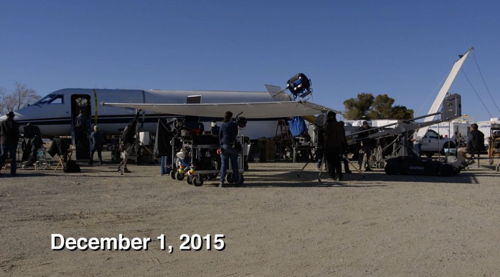 Film crew working on a mock up of a jet