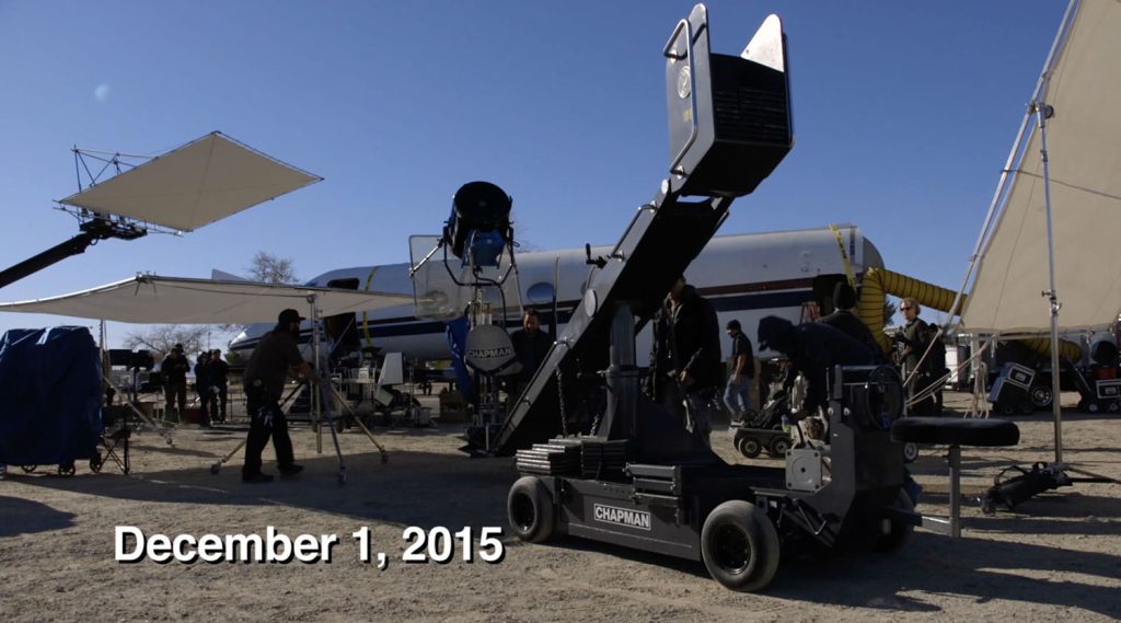 Film crew working on a mock up of a jet