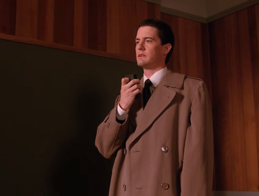 Special Agent Dale Cooper speaking into a micro cassette recorder