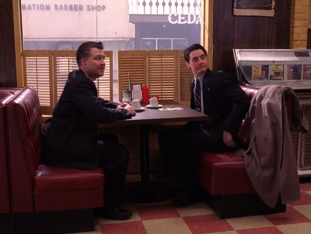 Regional Bureau Chief Gordon Cole and Agent Dale Cooper at a booth in the Double R Diner
