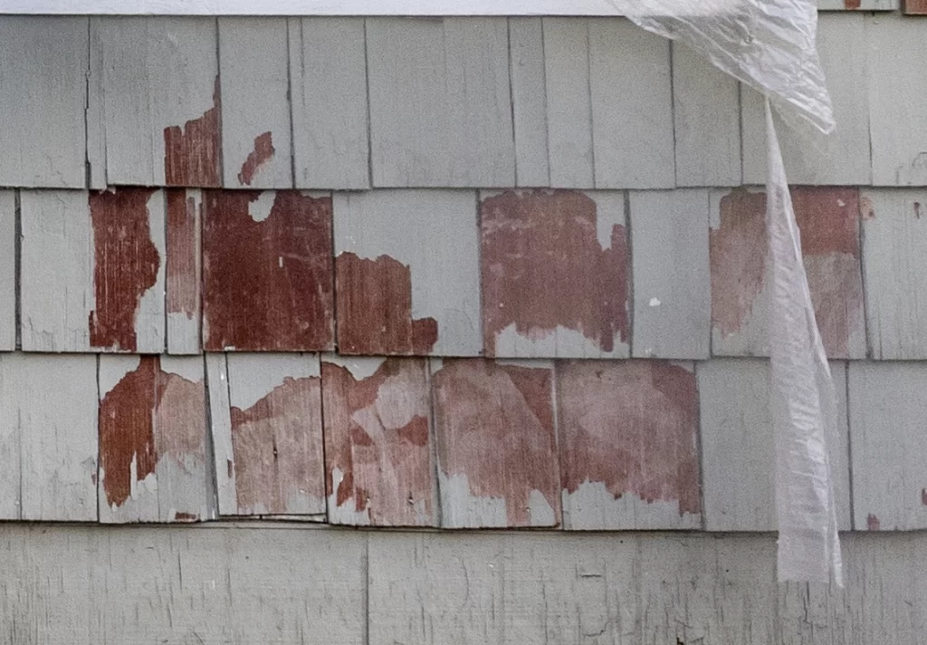 Siding with paint peeling