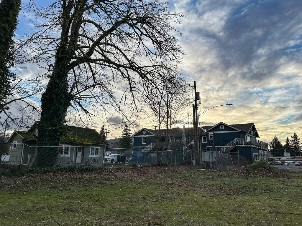 Roadhouse and Bookhouse under cloud-filled sky