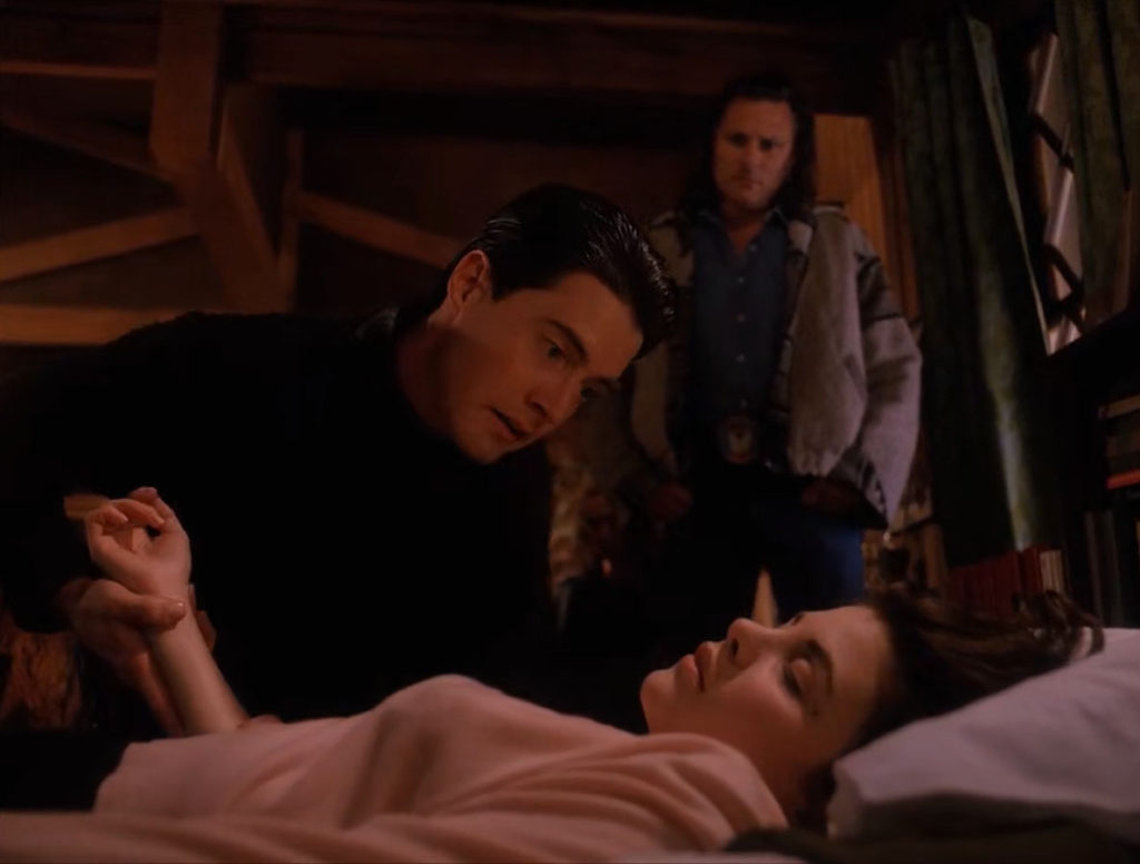 Agent Cooper carrying Audrey Horne as Hawk follows