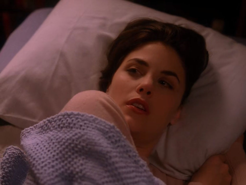 Audrey Horne laying in bed