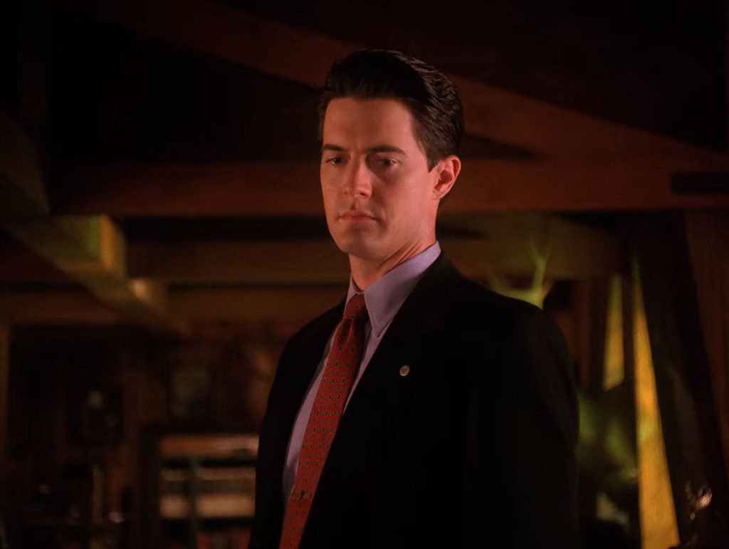 Dale Cooper standing in the Bookhouse