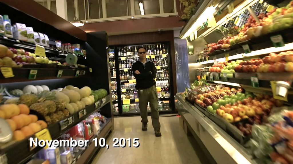 Man standing in grocery store aisle