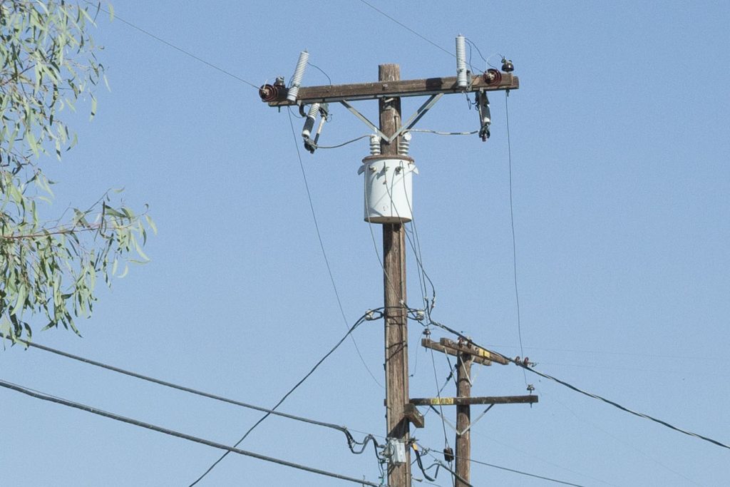 Utility pole along the side of a street