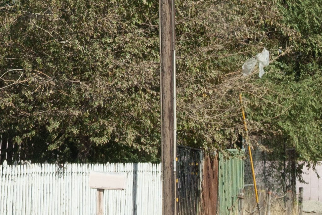 Utility pole along the side of a street