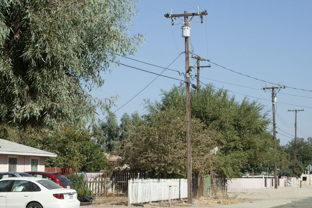 Utility pole along the side of a street