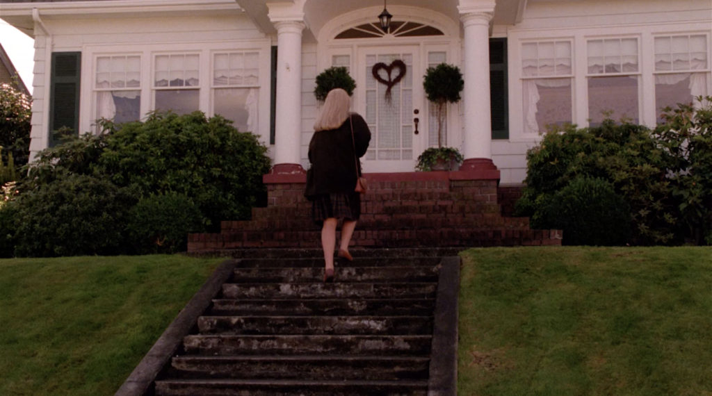 Laura Palmer arrives home walking up stairs to front door