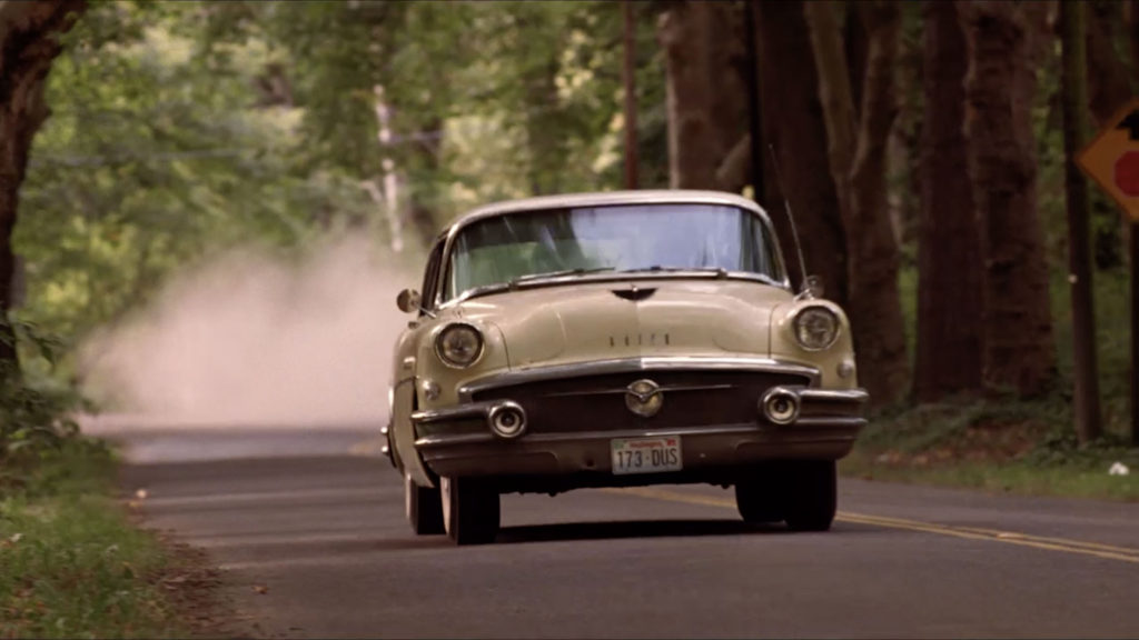 1956 Buick Roadmaster driving down the road