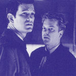 Blue-hued image of Agent Chet Desmond and Sam Stanley